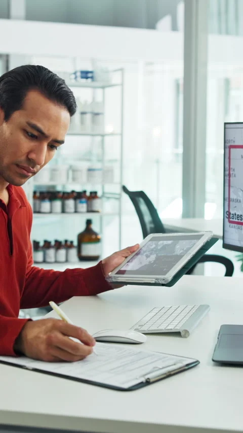Tablet, computer and businessman with clipboard in office for research with Stock Footage 335372325