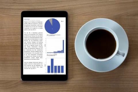 Tablet computer and cup of coffee Stock Photos