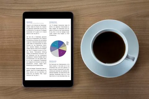 Tablet computer and cup of coffee Stock Photos