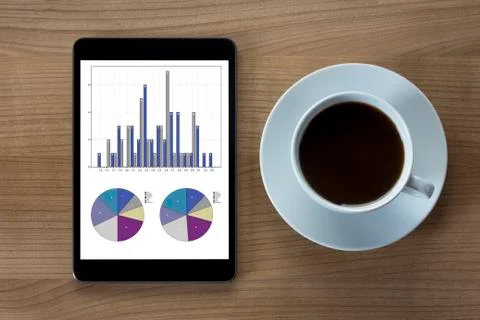 Tablet computer and cup of coffee Stock Photos