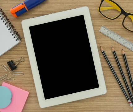 Tablet computer and stationery Stock Photos