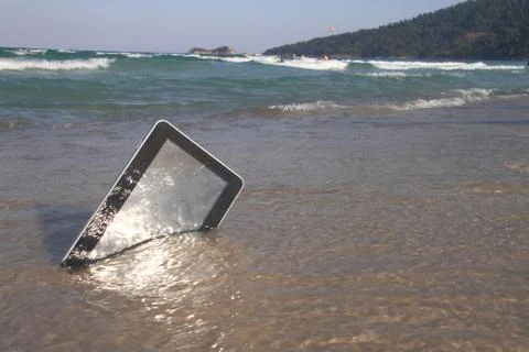 Tablet computer on the beach Stock Photos