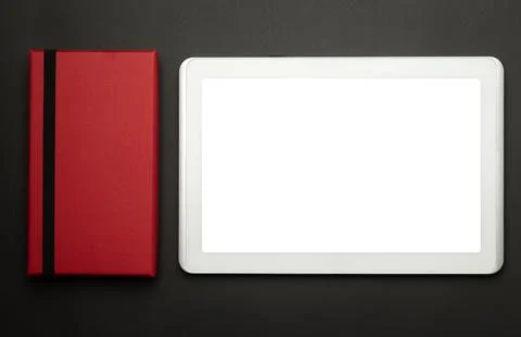 Tablet computer with blank screen and red box on black background Stock Photos