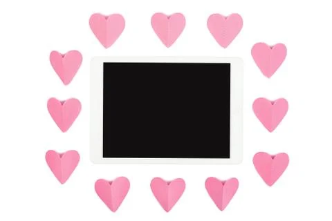 Tablet computer with blank screen isolated on white background with pink paper Stock Photos
