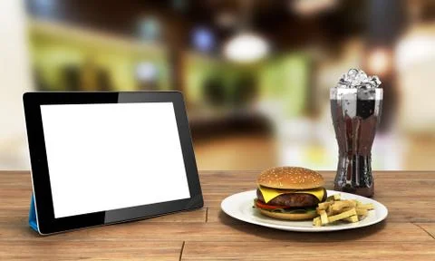 Tablet computer with a blank screen on the wooden table with a hamburger and Stock Illustration