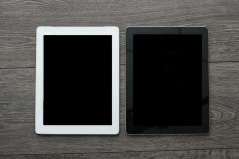 Tablet computer on boards. White screen. Top view. Stock Photos