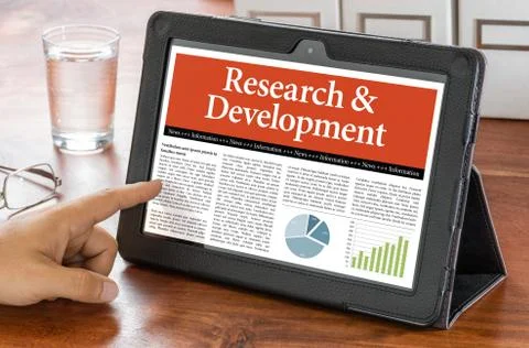 A tablet computer on a desk - Research and Development Stock Photos