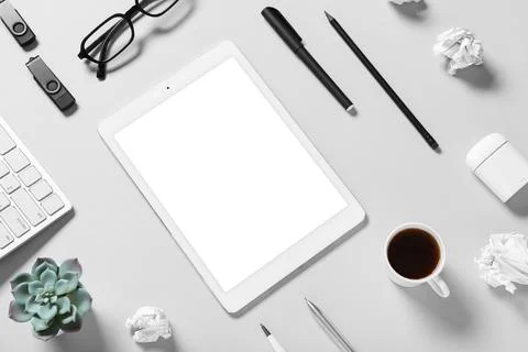 Tablet computer with different modern gadgets, cup of coffee, crumpled paper  Stock Photos