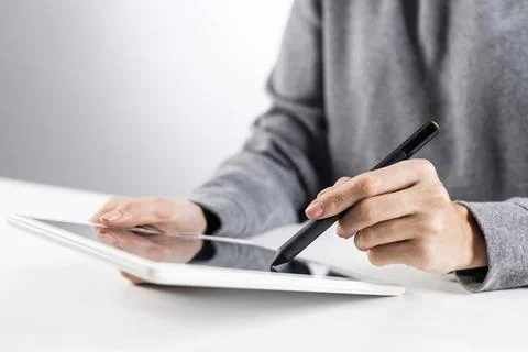 Tablet computer for financial data analysis Woman using tablet computer fo... Stock Photos