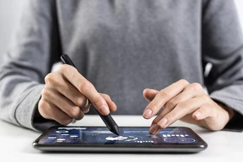 Tablet computer for financial data analysis Woman using tablet computer fo... Stock Photos