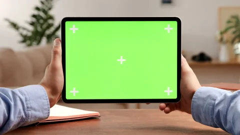 Tablet computer with green screen and chroma key for video conference. Mockup of Stock Footage 199482548