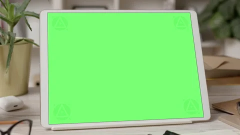 Tablet Computer with Green Screen in Cozy Office Interior Video stock 170886060
