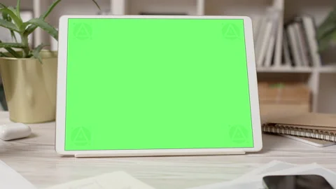 Tablet Computer with Green Screen in Cozy Office Interior Video stock 172132300