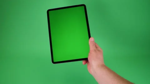 Tablet computer handheld on Green screen Chromakey pt 3 of 14 Stock Footage 194867559