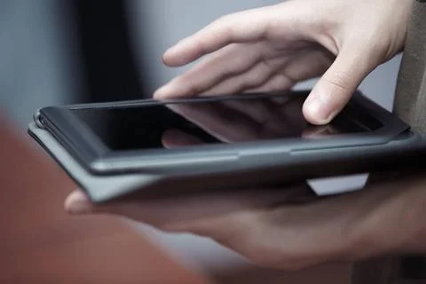  Tablet computer Hands of person using black tablet computer ,model releas... 写真素材