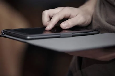  Tablet computer Hands of person using black tablet computer ,model releas... 写真素材