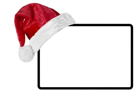 A tablet computer isolated with a Santa Claus hat for Christmas on the white Stock-Fotos