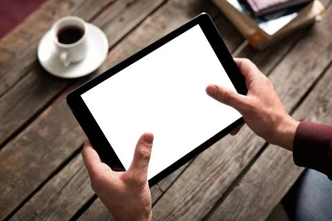 Tablet computer with isolated screen in male hands 写真素材