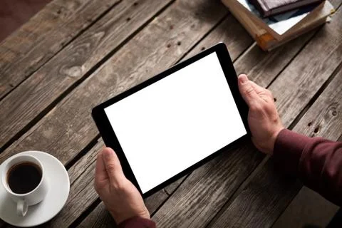 Tablet computer with isolated screen in male hands Foto stock