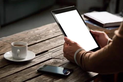 Tablet computer with isolated screen in male hands Foto stock