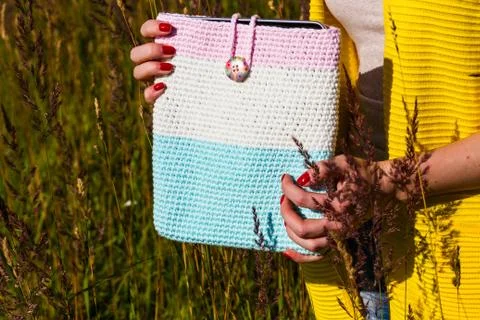 Tablet computer in a knitted cover Stock Photos