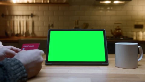 Tablet computer with mock up green screen chromakey standing on the table i.. Stock Footage 277185770