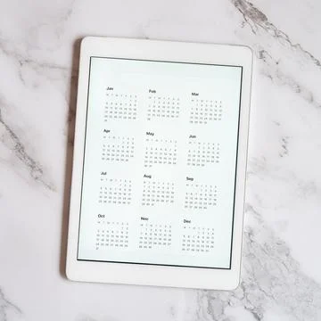 Tablet computer with an open app of calendar for unspecified date year withou Stock Photos