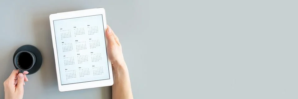 Tablet computer with open app of calendar for unspecified unknown date year w Stock Photos