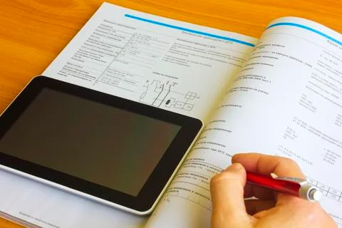 Tablet computer over engineering diagram Stock Photos