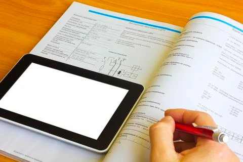 Tablet computer over engineering diagram Stock Photos