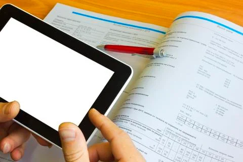 Tablet computer over engineering diagram Stock Photos