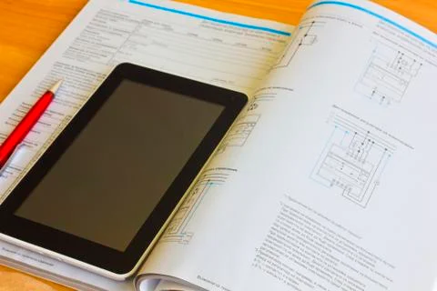 Tablet computer over engineering diagram Stock Photos
