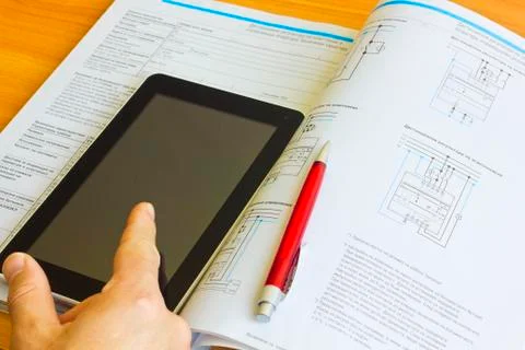 Tablet computer over engineering diagram Stock Photos