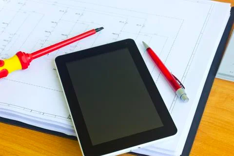 Tablet computer over engineering diagram Stock Photos