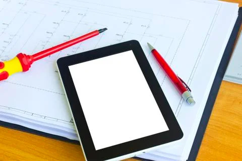 Tablet computer over engineering diagram Stock Photos