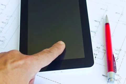 Tablet computer over engineering diagram Stock Photos