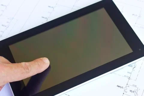 Tablet computer over engineering diagram Foto stock