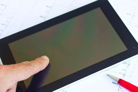 Tablet computer over engineering diagram Stock Photos