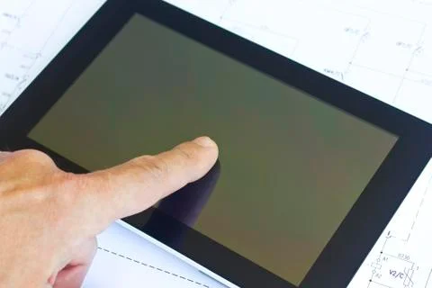 Tablet computer over engineering diagram 스톡 사진