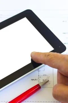 Tablet computer over engineering diagram Stock Photos