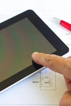 Tablet computer over engineering diagram Stock Photos