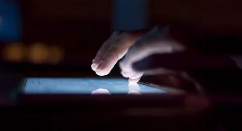 Tablet Computer Screen Light Night Finger Tapping Application Development Stock Footage 49616571