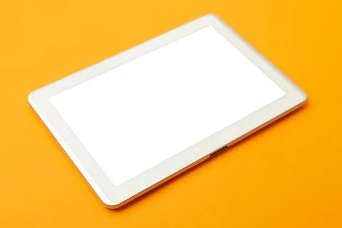 Tablet computer screen mockup with clipping path on orange background Stock Photos