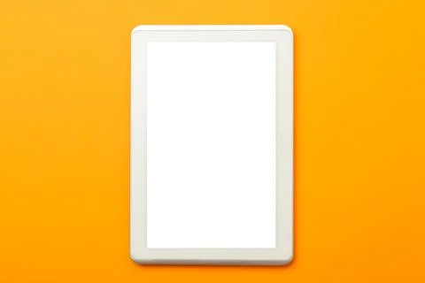 Tablet computer screen mockup with clipping path on orange background Stock Photos