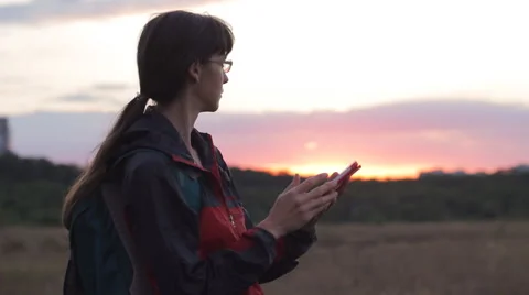 Tablet computer woman hiking in nature using travel app or map for navigation Stock Footage 64092425