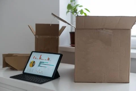 Tablet computers. Online products to prepare product boxes with graph business Stock Photos