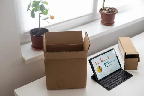 Tablet computers. Online products to prepare product boxes with graph business Stock Photos
