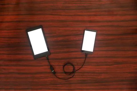 Tablet connected to smartphone. Data transfer. 写真素材
