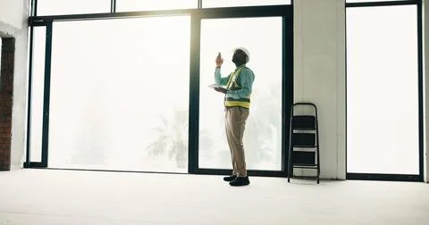Tablet, construction and black man in building for inspection, evaluation a.. Stock Photos