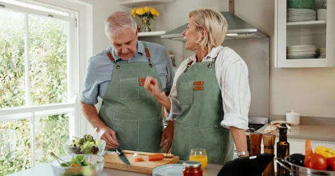 Tablet, cooking and senior couple in home kitchen with online recipe, bonding Stock Footage 341104155